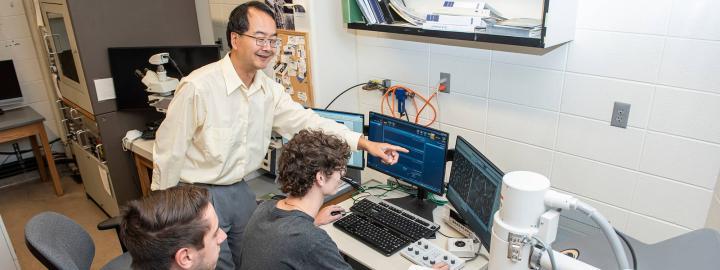 Dong Chen instructs students in the SEM Lab